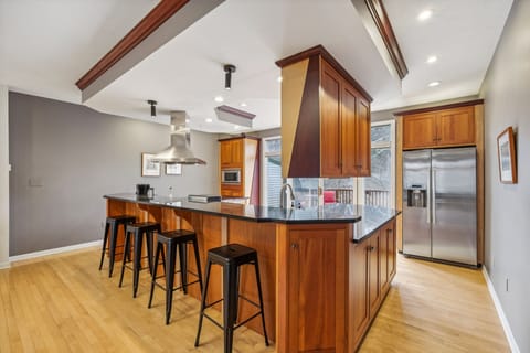 Modern kitchen with Thermador stove/oven, Bosch fridge and dishwasher.