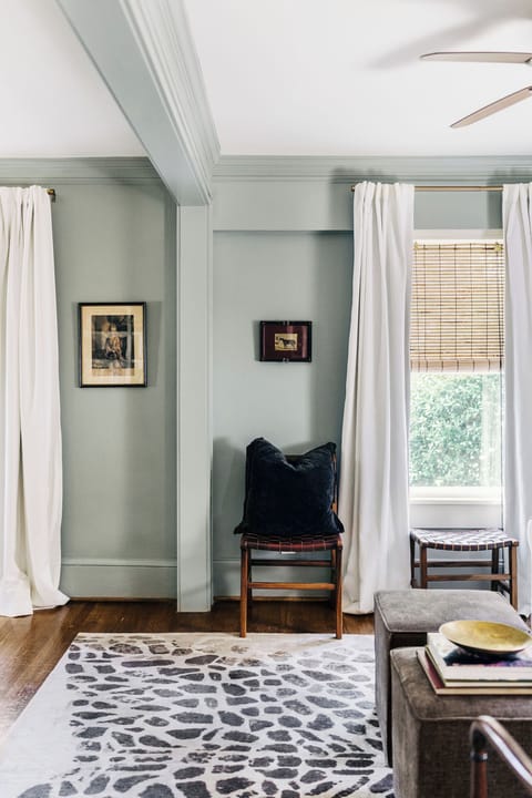 Living room with a wide collection of books and antiques. 
