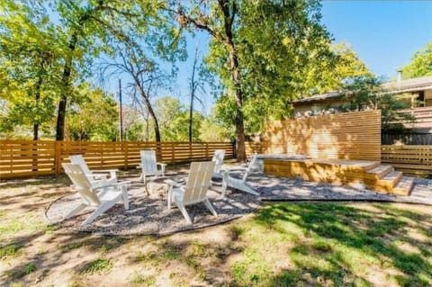 Backyard with firepit, grill, cowboy pool.