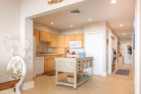 Gourmet kitchen area offering wood cabinets and central island.