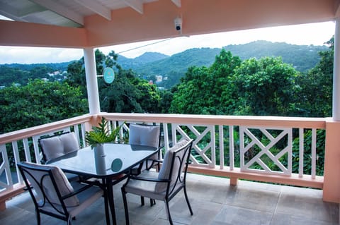 Breezy terrace dining with lush mountain views, perfect for relaxed mornings