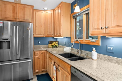 The Kitchen is fully equipped with a large fridge, dishwasher, stove top, oven, toaster and coffee maker.