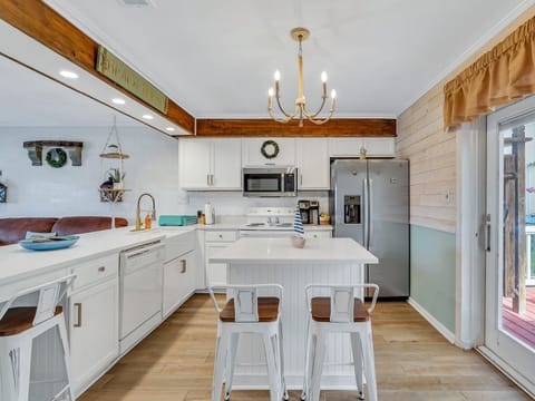 The kitchen is fully equipped with everything needed to make a great meal at home.