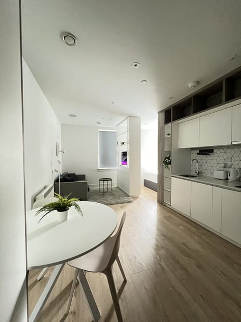 Modern living room connected to kitchen and dining area