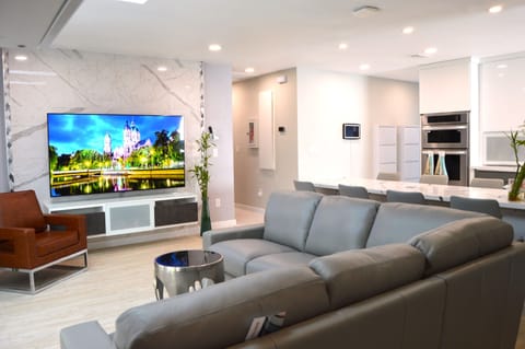 Modern living room: 72 inches smart TV on an accent wall 