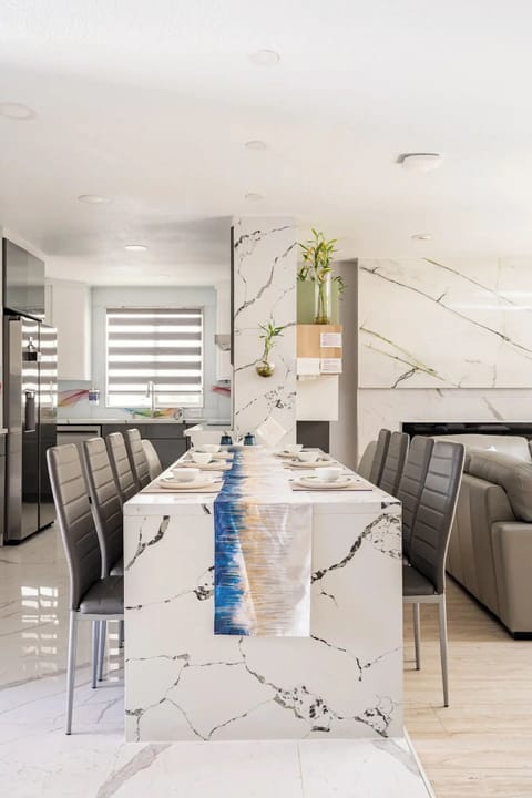  Flowing countertop island dining table evoke a seascape ambiance