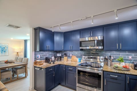 Fully equipped kitchen with French door refrigerator, range and dishwasher