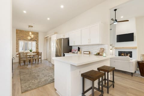 View of kitchen/ kitchen side seats