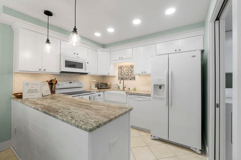 Recently remodeled kitchen with modern appliances.