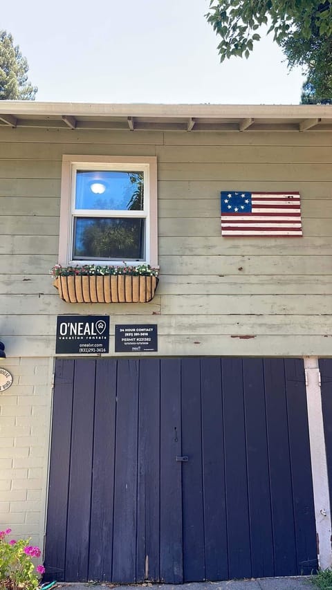 Permit Regulation Sign: Located on the front of the house, in the driveway