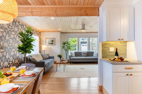 Living room opens to the dining area and kitchen.