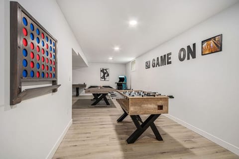 Basement Game Haven with Pool Table, Shuffleboard, Foosball, Giant Connect 4, Pop-a-Shot, darts, wall tic-tac-toe, Ring Toss, Pinball, 8 arcade games, bar with smart TV, board games, large projector