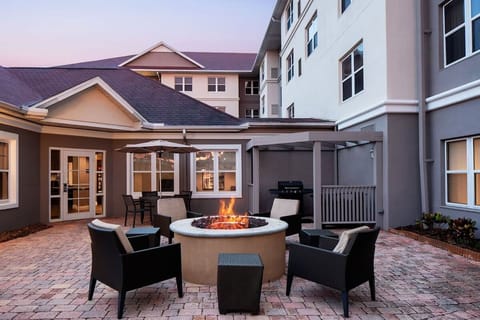 Unwind by the glowing fire pit under an evening sky.