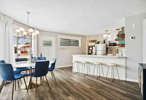 Dining table seats eight people and the breakfast bar is perfect for four people.