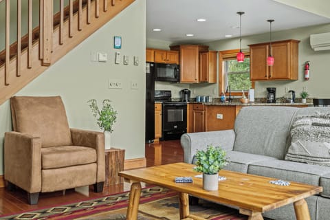 Open, airy living room with a comfortable couch and plenty of natural light.