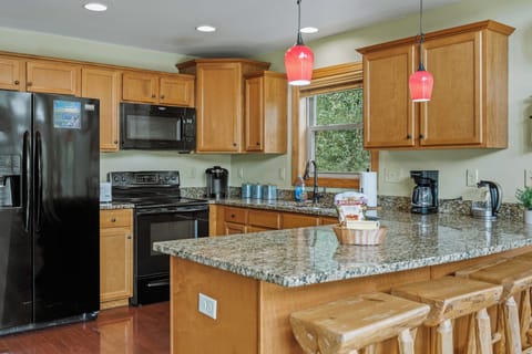 Modern kitchen with sleek appliances and ample counter space.