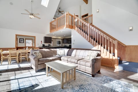 Open concept living room with stairs leading up