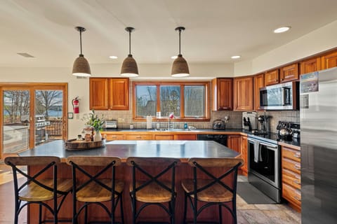 Barstool seating at the kitchen counter.