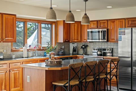 Barstool seating at the kitchen counter.