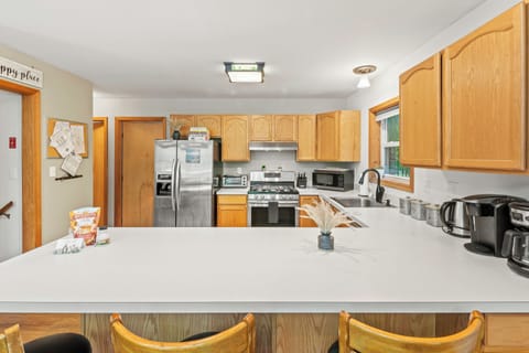 Spacious countertop and barstool seating.