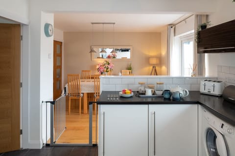 Cae Cloc kitchen with view to dining table