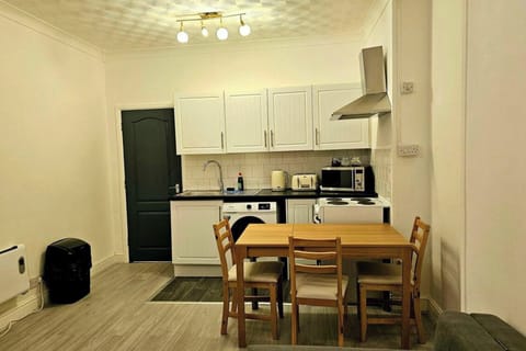 Enjoy meals in the dining area equipped with a table and chairs. Ideal for sharing meals, planning your day, or enjoying a cup of coffee. 
