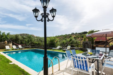 Enjoy the outdoor area with a swimming pool and a dedicated barbecue area