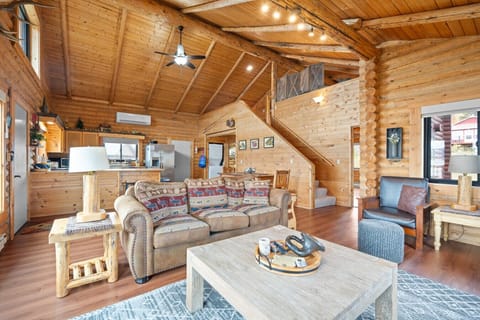 Inviting living room with plush seating and open layout connecting to the kitchen.