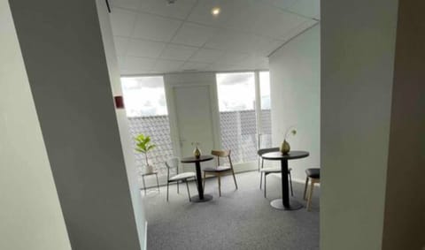 Quiet seating area with natural light, ideal for casual conversations or enjoying a peaceful moment.