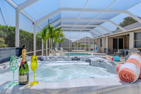 Sparkling Pool - - Hot tub with a view of the sparkling pool for the ultimate relaxation experience
- Colorful towels, champagne, and glasses add a touch of elegance to your leisure time
- Enjoy seamless indoor-outdoor living in a beautifully designed space