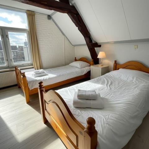 Unwind in this large, comfortable bedroom — the perfect spot to get the rest you deserve during your Tilburg stay.