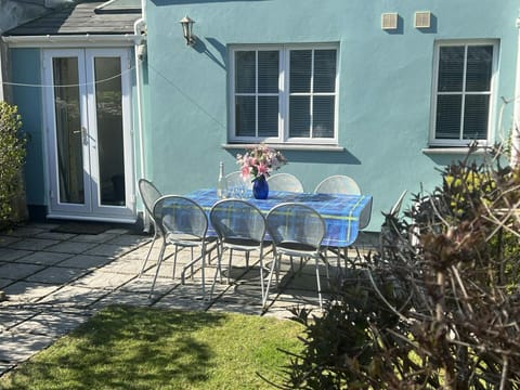 Outdoor seating area with table and eight chairs
