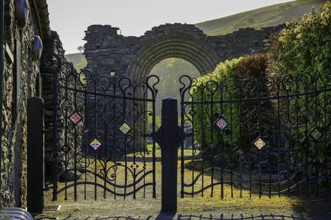 Gates as the entrance to Strata Florida Abbey ruins