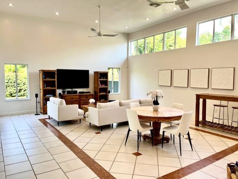 Florida Room with home theater, dining, bar, sky, terrace & garden vews