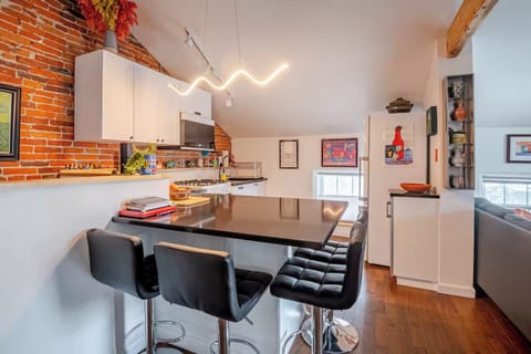 Kitchen island comfortably sits 4 and makes a great work area.