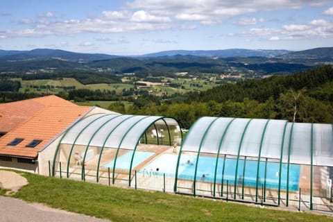 Indulge in our seasonal pool with a removable roof—open from mid-June to mid-September for sun-soaked swims or sheltered relaxation,