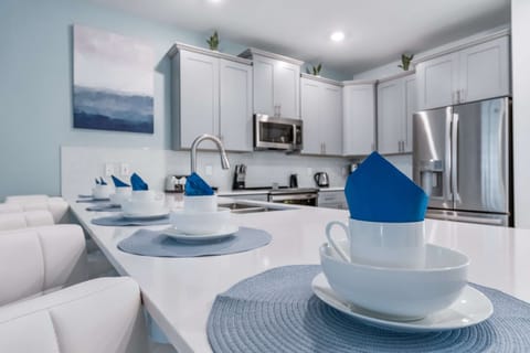 Elegant dining area with stylish table setting, modern decor, and open layout
