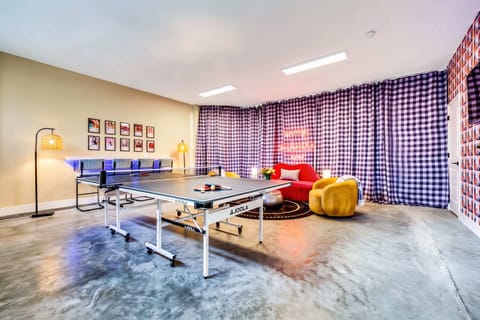 Gather your crew for a fun-filled getaway in this vibrant game room, perfect for laughter and friendly competition! Experience the heart of Music City with Misfit Homes. Reserve your stay today!