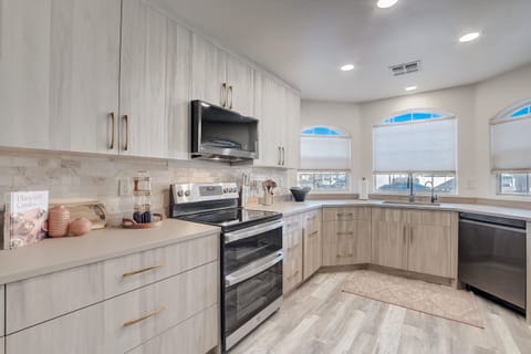 Its sleek design and user-friendly interface complement the kitchen's practicality, adding a touch of comfort and luxury to daily routines.