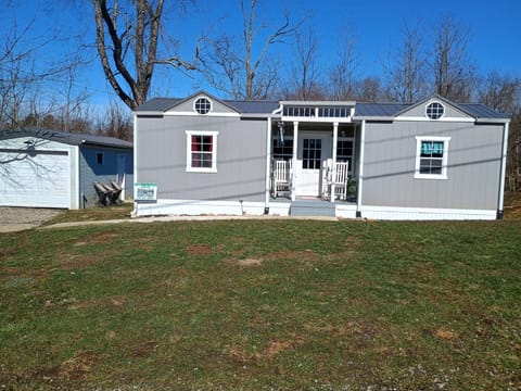 Front view of the Tiny House which includes additional parking to the left side