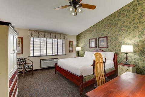 Unwind on crisp linens in a calm, spacious bedroom.