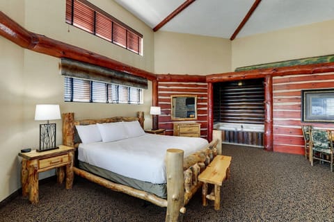 Drift off in a cozy log bed with cabin charm.
