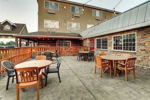 Sip drinks outdoors under string lights on the open patio.