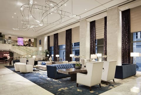 Settle into a grand lobby lounge beneath sparkling designer lighting.