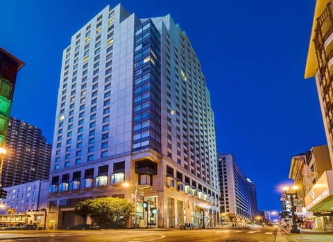 Arrive in style at a glowing high-rise city hotel.