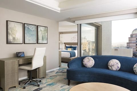 Settle in with a dedicated desk and sunlit suite views.