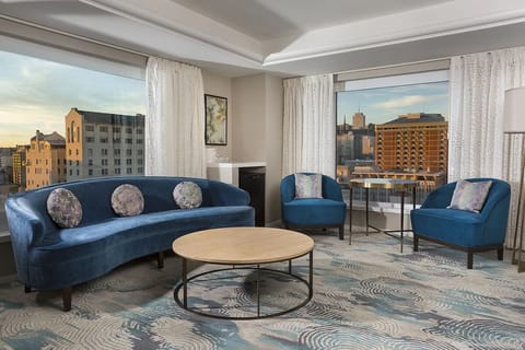 Gather by panoramic windows and lounge in plush seating.