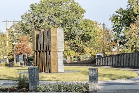 Park with "I am a man" in front of the property. 