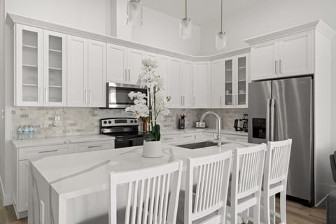 Stainless-steel appliances, coffee station, and everything you need for meals at home