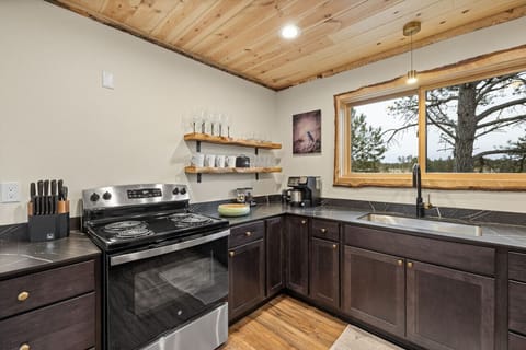 with cups, bowls, plates, mugs, silverware and every cooking utensil you’d need (including barbecue tools)!